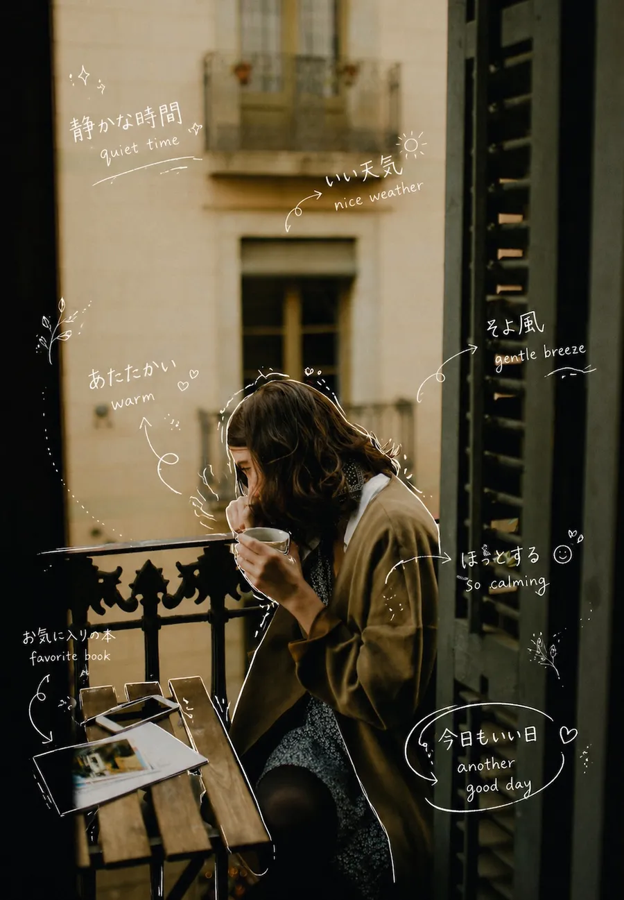 The same balcony photo after Sorae: thin white handwritten notes in Japanese and English such as “quiet time”, “gentle breeze” and “another good day” traced around her